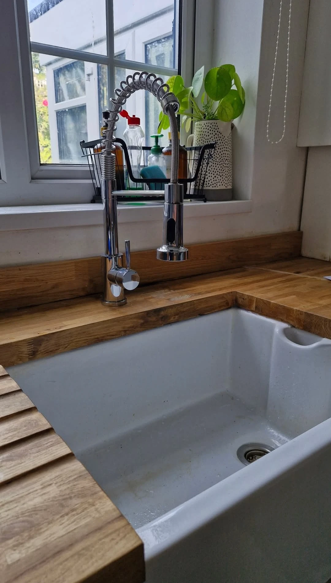 New belfast sink with wooden worktop and chrome mixer tap.